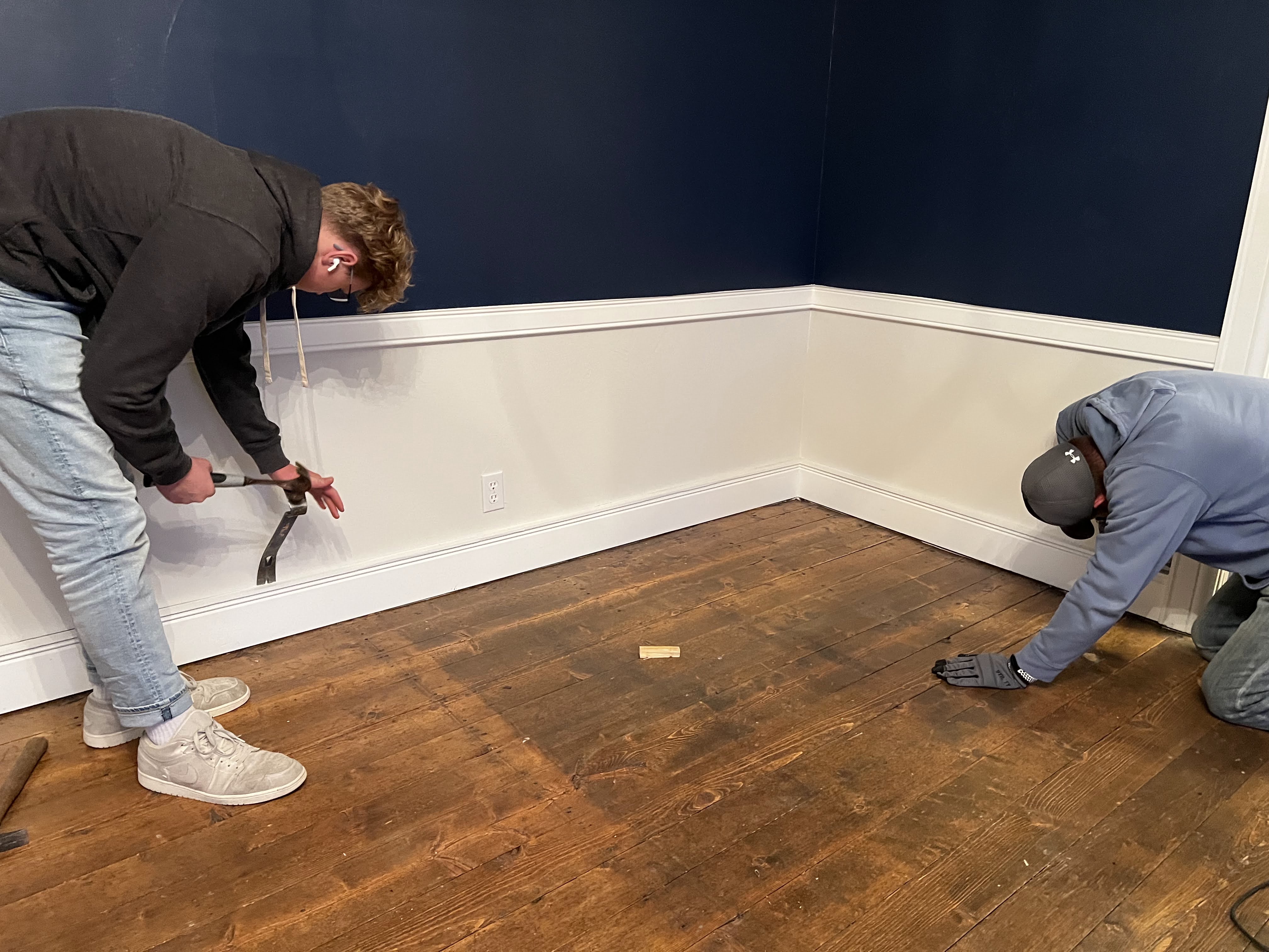 Upstairs landing with original boards ready for removal